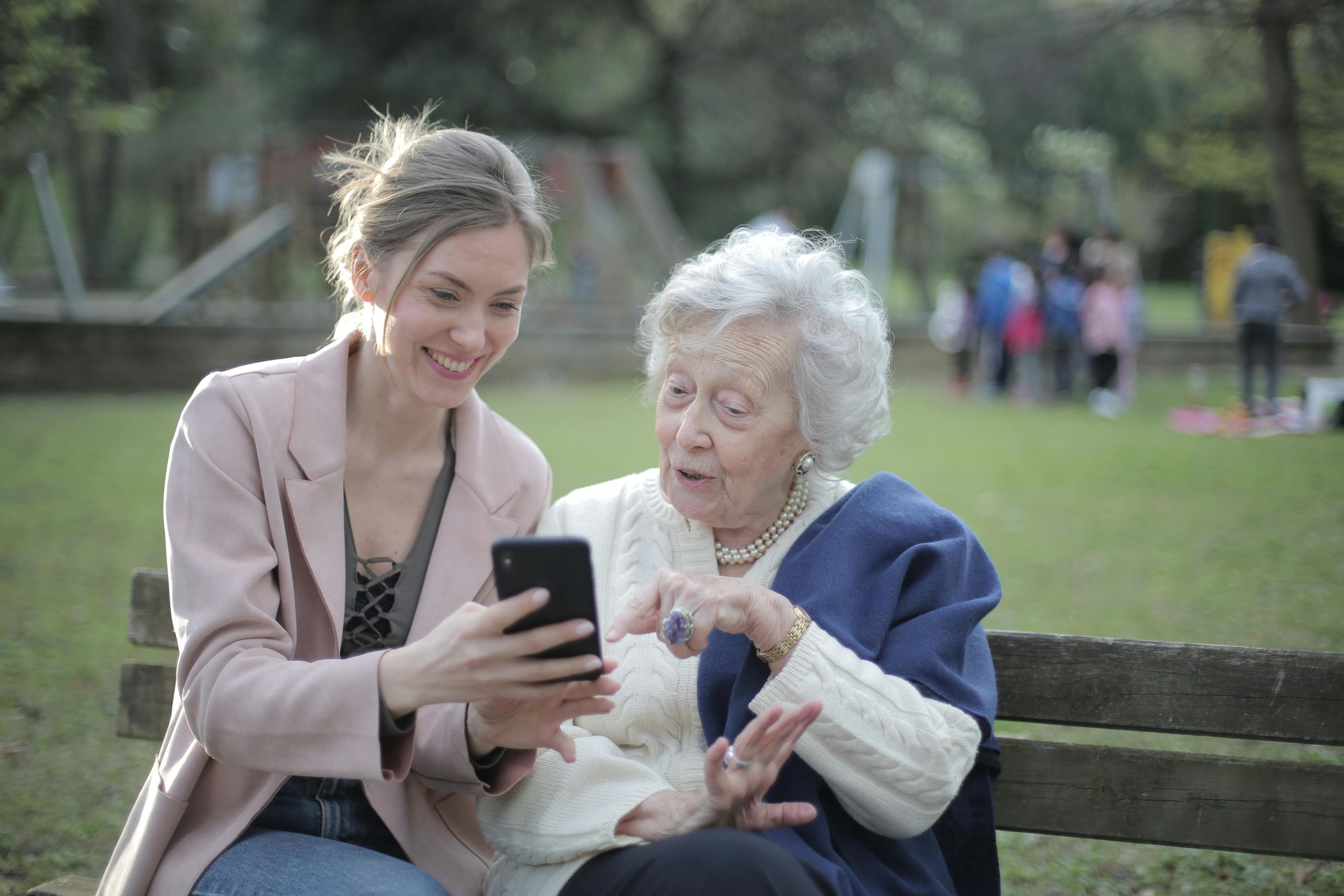 cheerful-senior-mother-and-adult-daughter-using-smartphone-together.jpeg